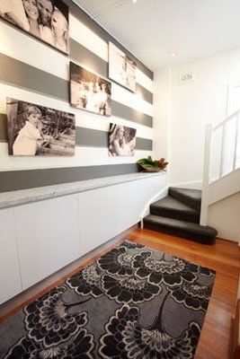 Custom Joinery and rug with feature wallpapered photo gallery